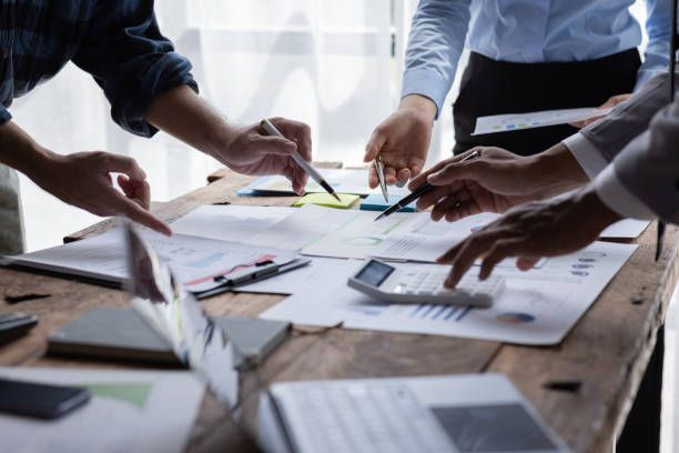 Professionals collaborating around a planning table